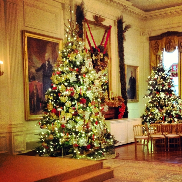 Stunning East Room Christmas trees with famous George Washington portrait in the background