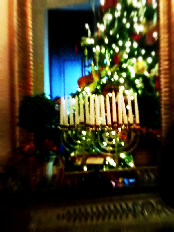 Love the reflection of the menorah and the Christmas tree 